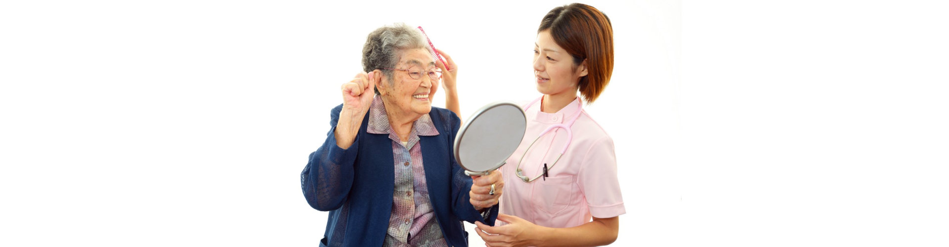 caregiver assisting senior woman taking care of her hai